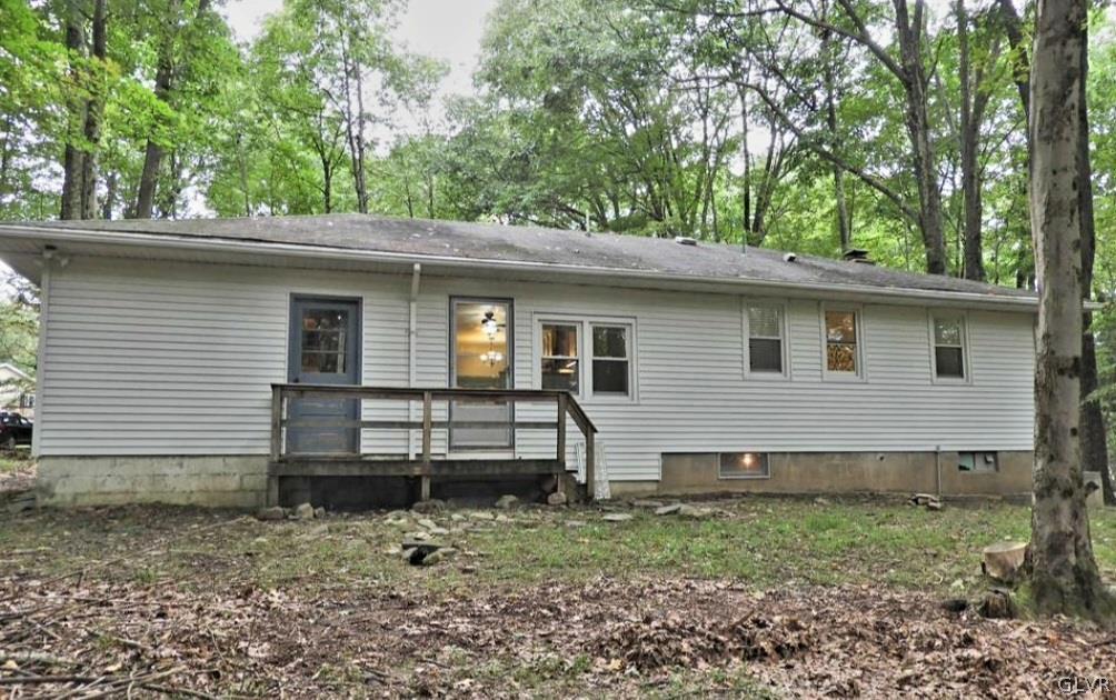 3110 Fern Road Pocono Summit, PA 18346 - Photo 18 of 20 a view of a house with a yard