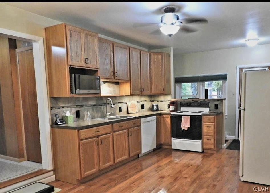 3110 Fern Road Pocono Summit, PA 18346 - Photo 5 of 20 a kitchen with stainless steel appliances granite countertop a stove a sink and a refrigerator