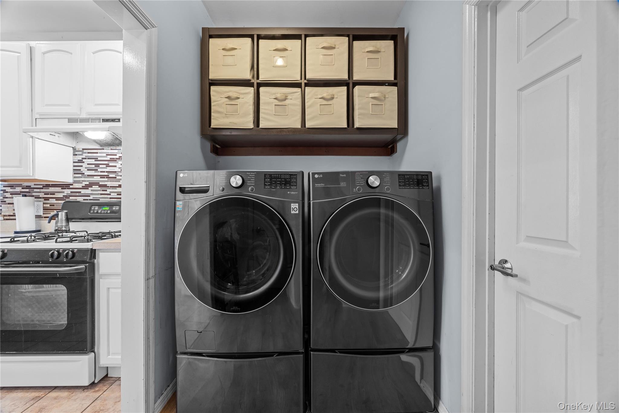 7 Bittersweet Lane Center Moriches, NY 11934 - Photo 16 of 32 a utility room with closet dryer and washer