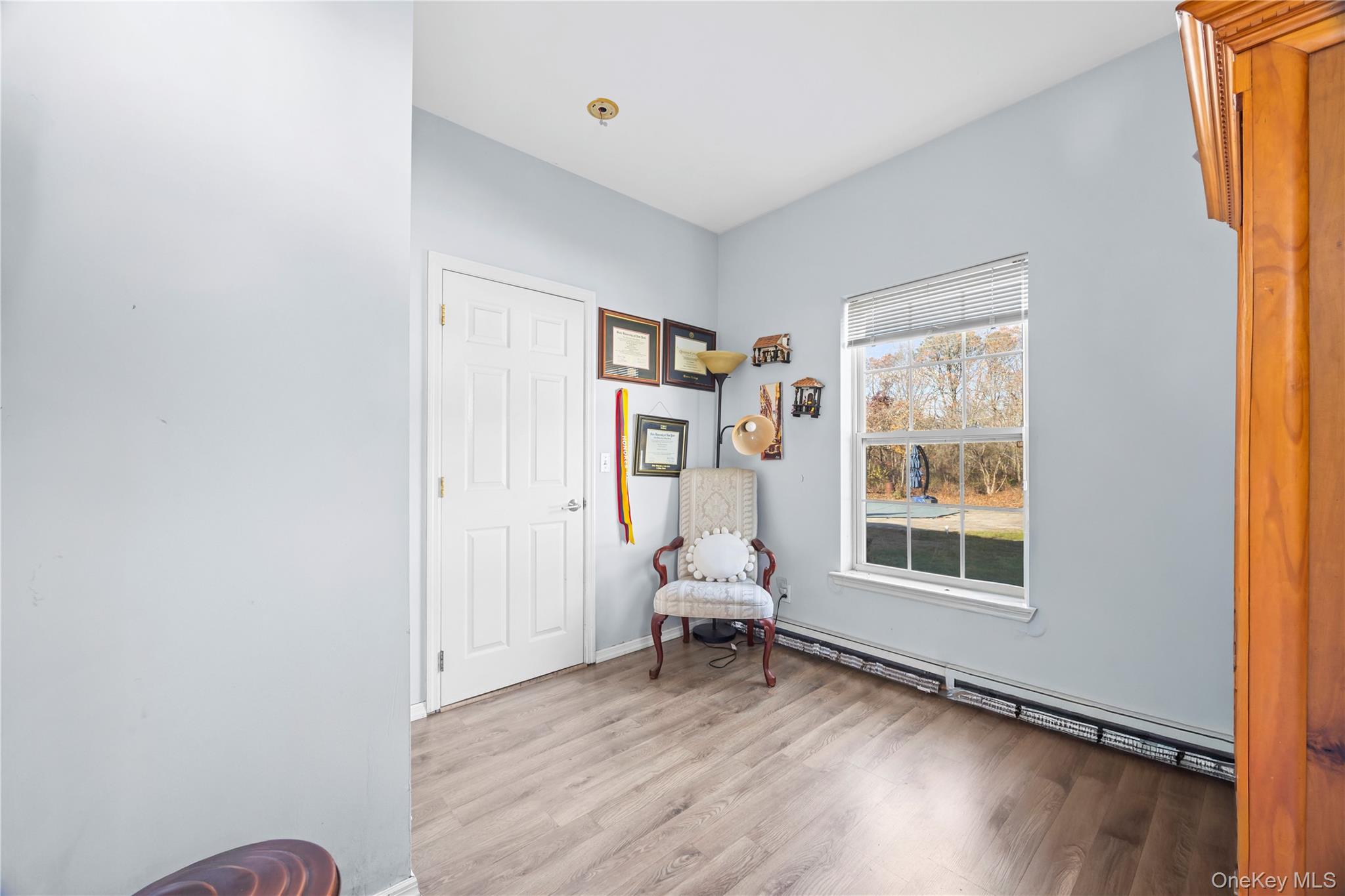 7 Bittersweet Lane Center Moriches, NY 11934 - Photo 17 of 32 a living room with furniture and a window