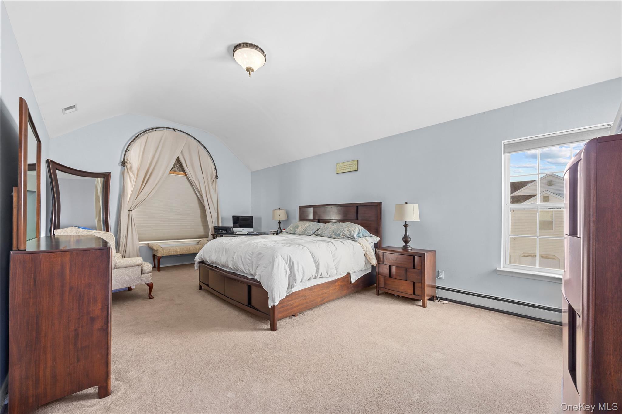 7 Bittersweet Lane Center Moriches, NY 11934 - Photo 22 of 32 a bedroom with a bed and a window