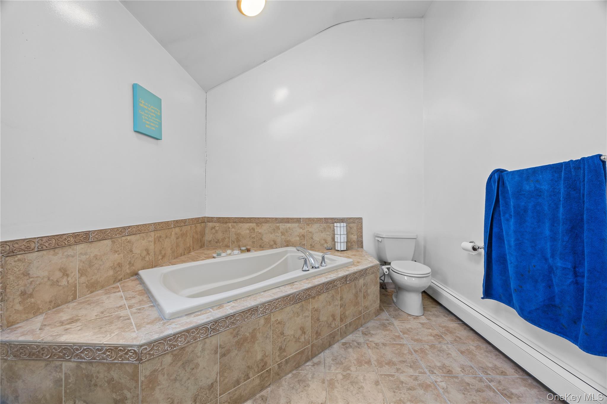 7 Bittersweet Lane Center Moriches, NY 11934 - Photo 25 of 32 a bathroom with a toilet a sink and bathtub