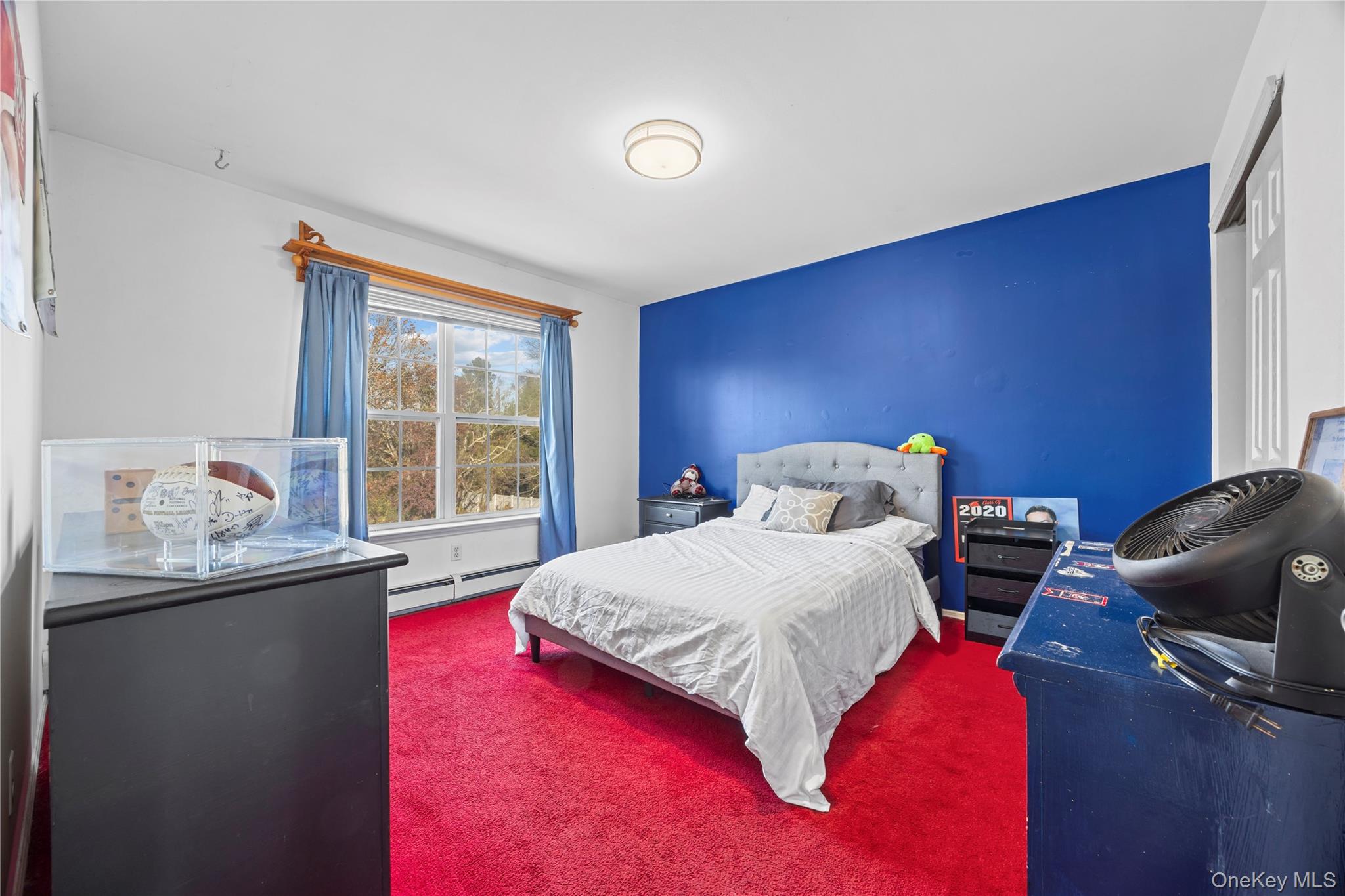 7 Bittersweet Lane Center Moriches, NY 11934 - Photo 27 of 32 a bedroom with a bed and window