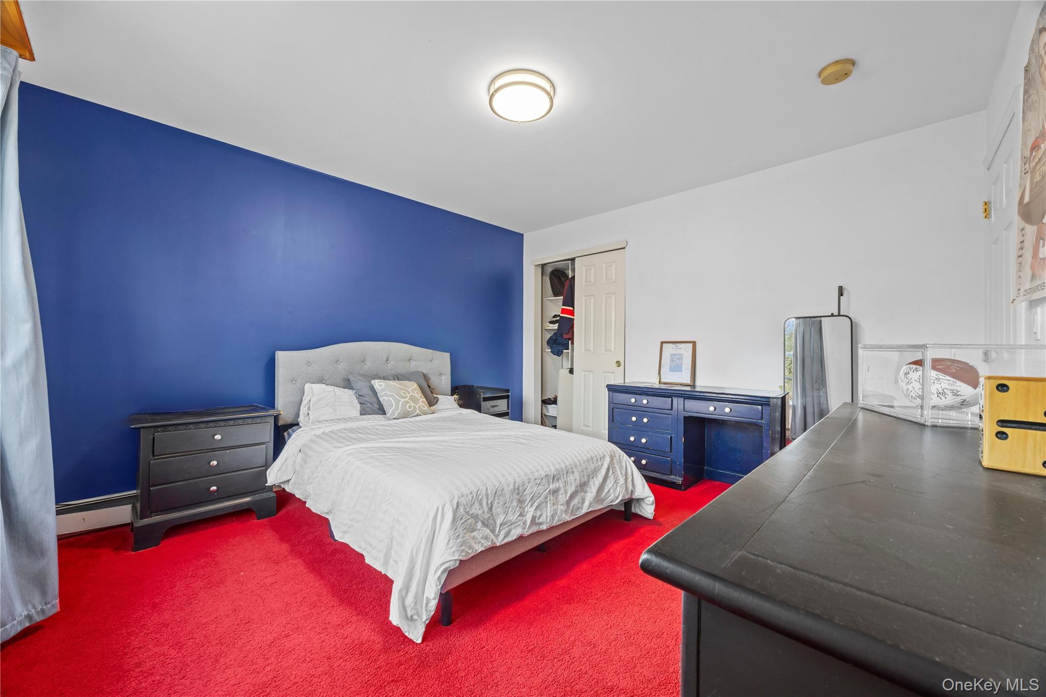 7 Bittersweet Lane Center Moriches, NY 11934 - Photo 28 of 32 a bedroom with a bed and two tables