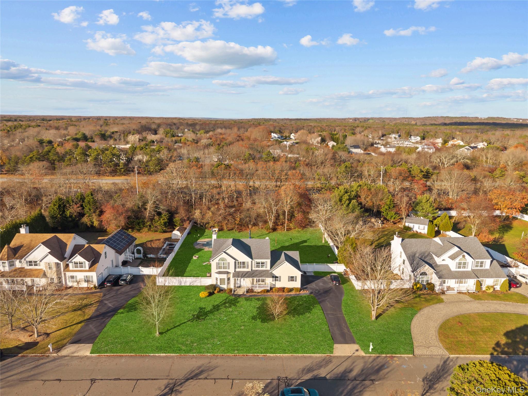7 Bittersweet Lane Center Moriches, NY 11934 - Photo 3 of 32 an aerial view of residential houses with outdoor space