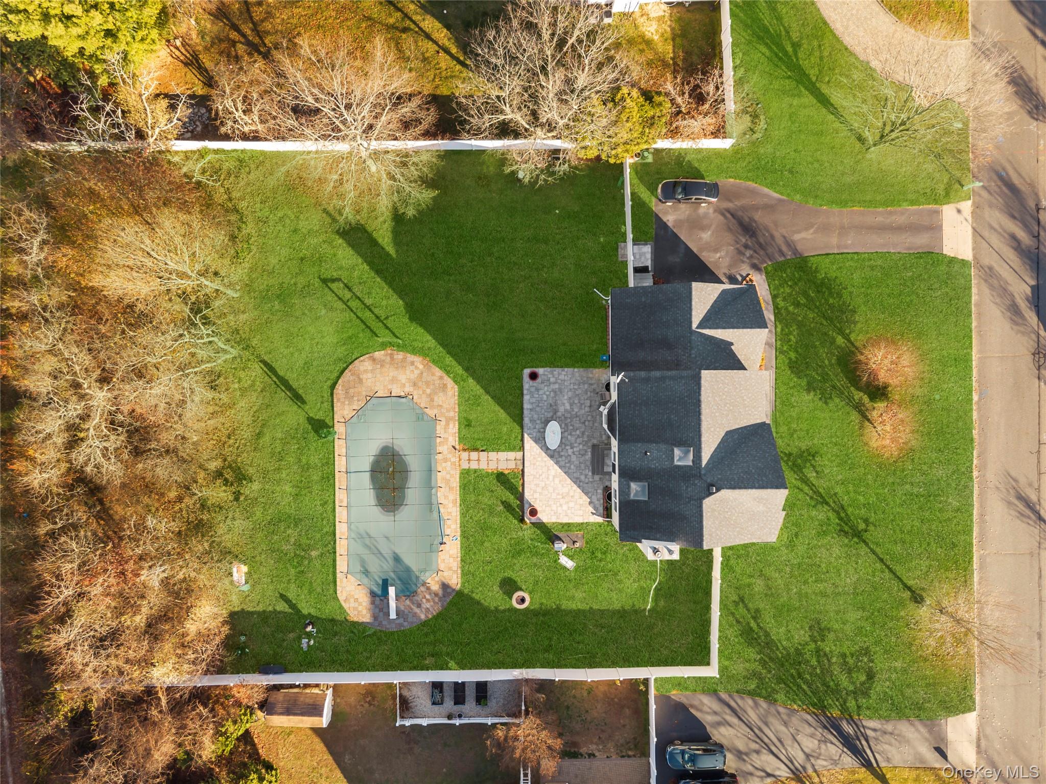 7 Bittersweet Lane Center Moriches, NY 11934 - Photo 5 of 32 an aerial view of a house with a garden and yard
