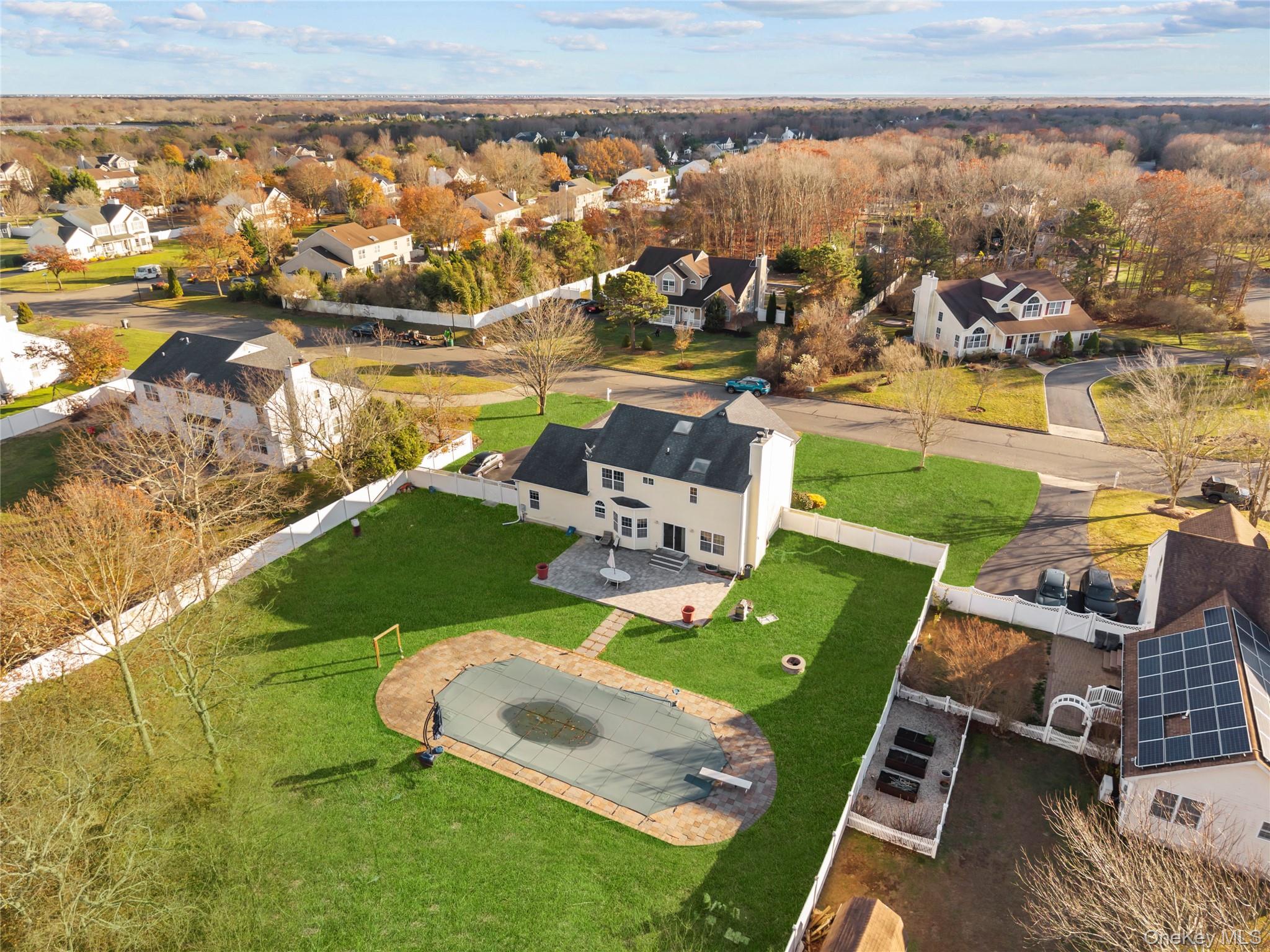 7 Bittersweet Lane Center Moriches, NY 11934 - Photo 6 of 32 an aerial view of a house with a lake view