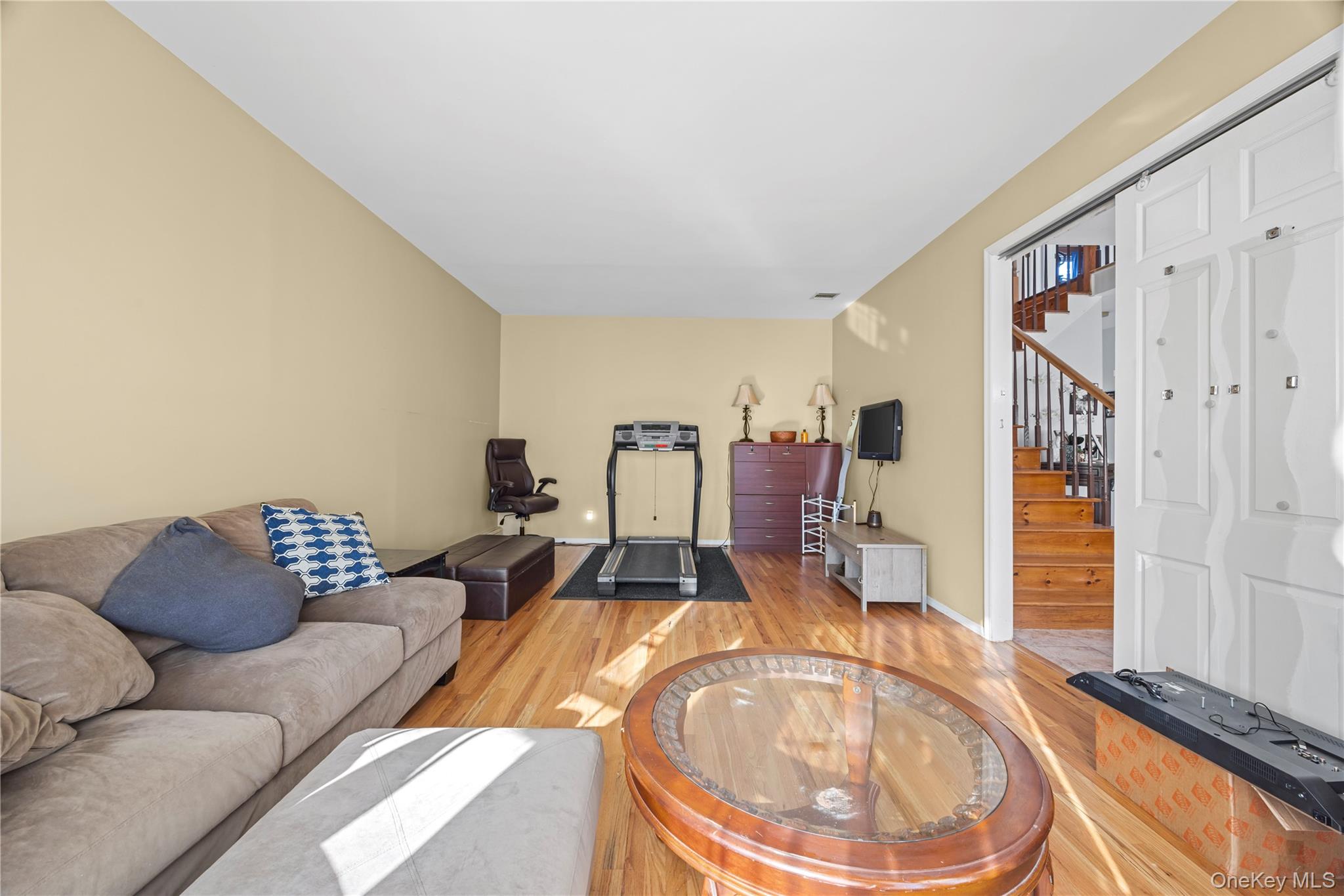 7 Bittersweet Lane Center Moriches, NY 11934 - Photo 9 of 32 a living room with furniture and wooden floor