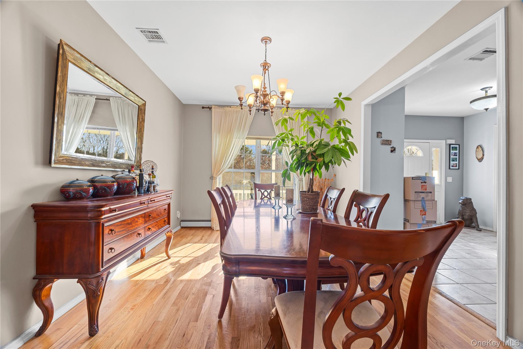 7 Bittersweet Lane Center Moriches, NY 11934 - Photo 10 of 32 a view of a dining room with furniture window and wooden floor