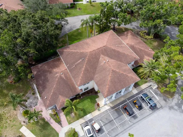 an aerial view of a house with outdoor space