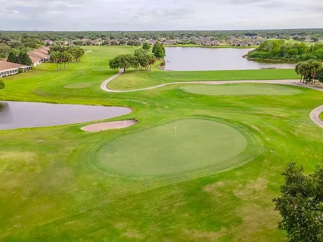 a view of a golf course with a big yard