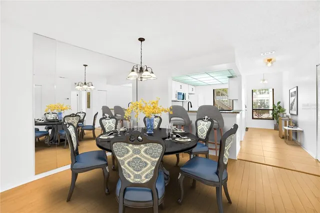 a dining room with furniture and wooden floor