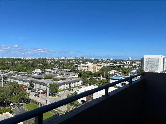 a view of a small house and a yard