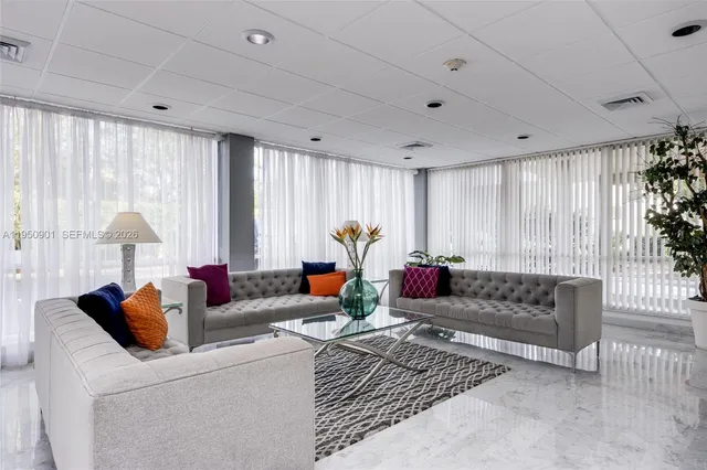 a group of people sitting in a room with chairs