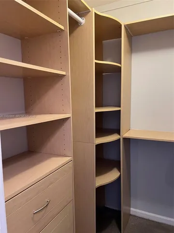 a view of an empty walk in closet