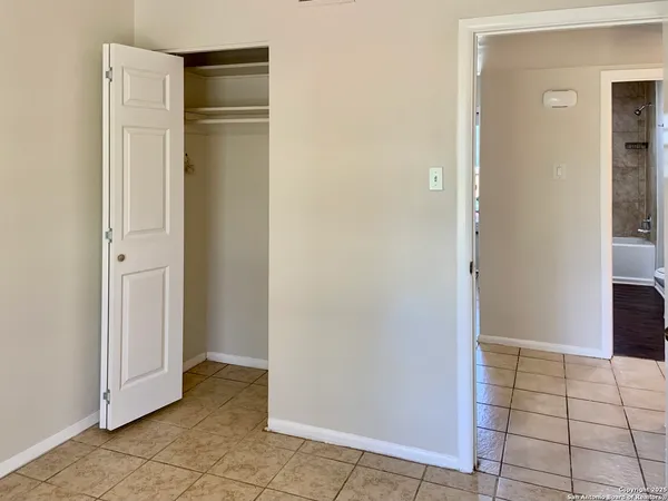 a view of a room with a hallway