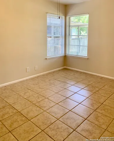 a view of a backyard with large trees