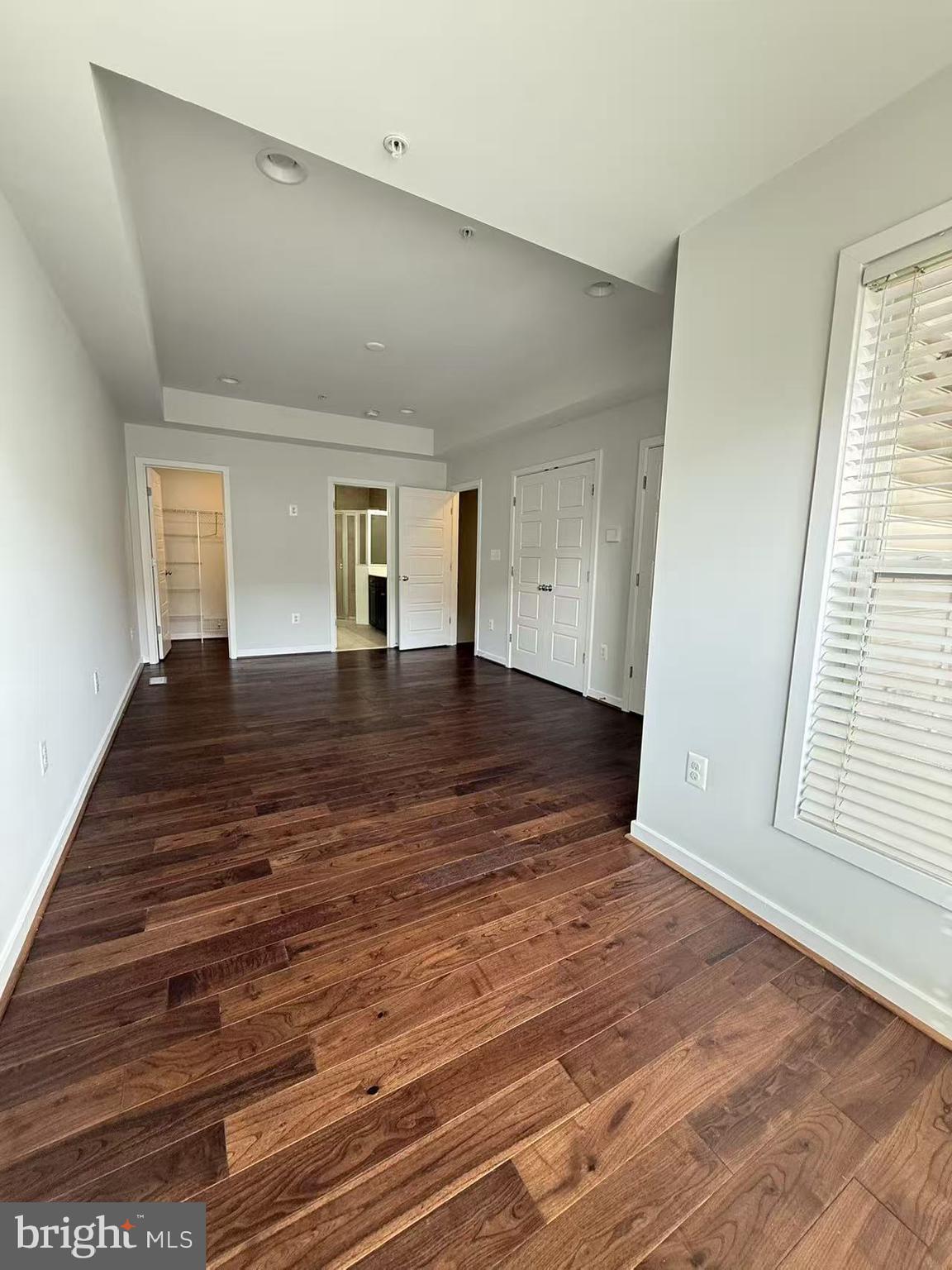 111 Kandinsky Loop Silver Spring, MD 20906 - Photo 13 of 16 wooden floor in an empty room with a window