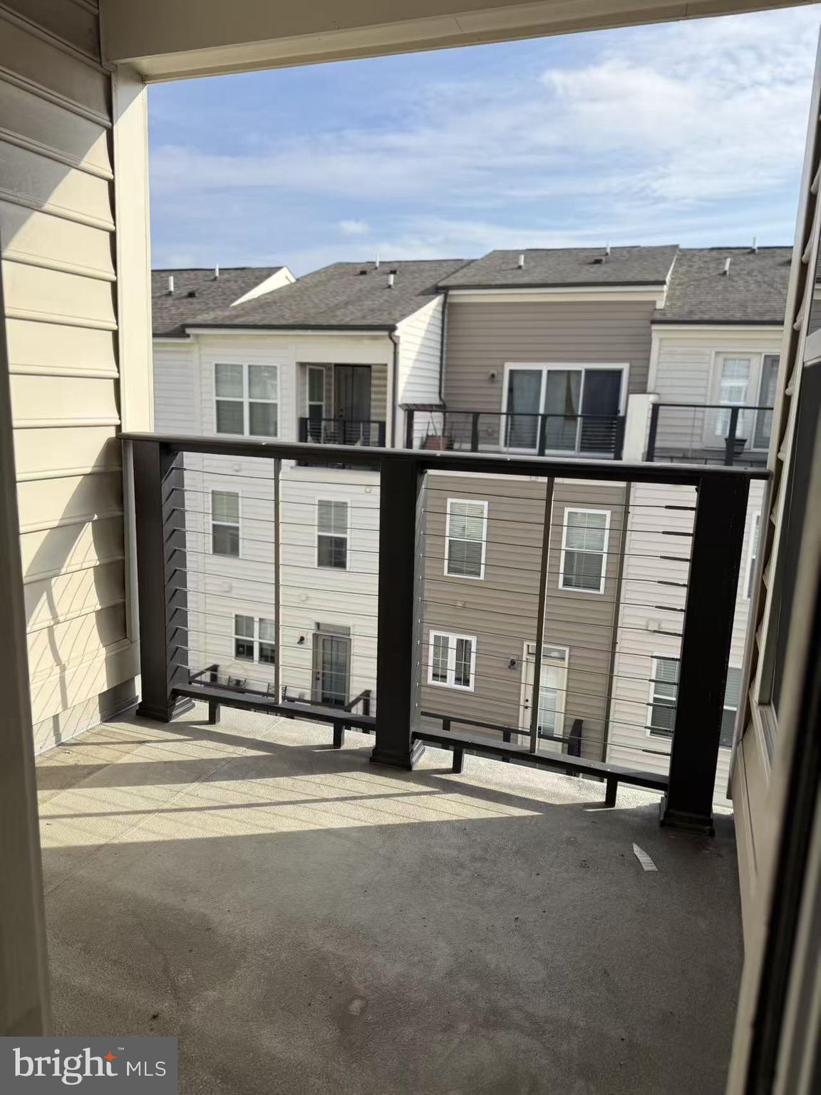 111 Kandinsky Loop Silver Spring, MD 20906 - Photo 15 of 16 a couple of table and chairs in front of house