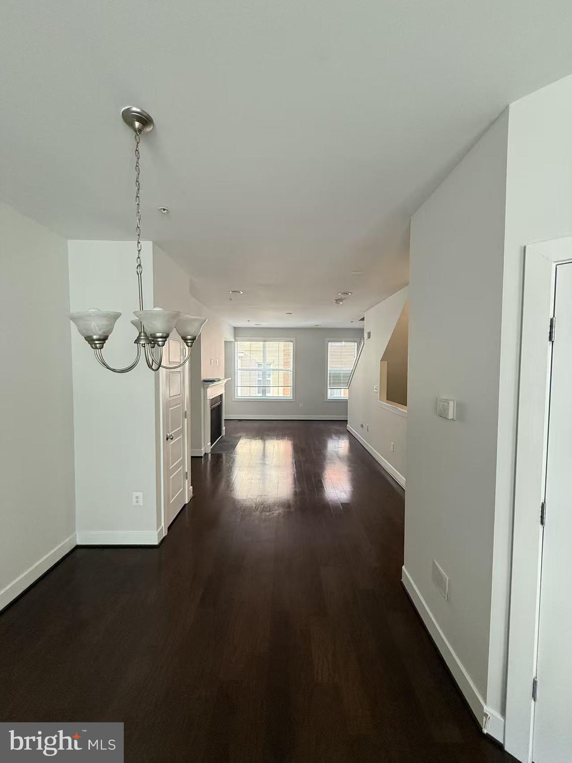 111 Kandinsky Loop Silver Spring, MD 20906 - Photo 8 of 16 a view of empty room with wooden floor and fan