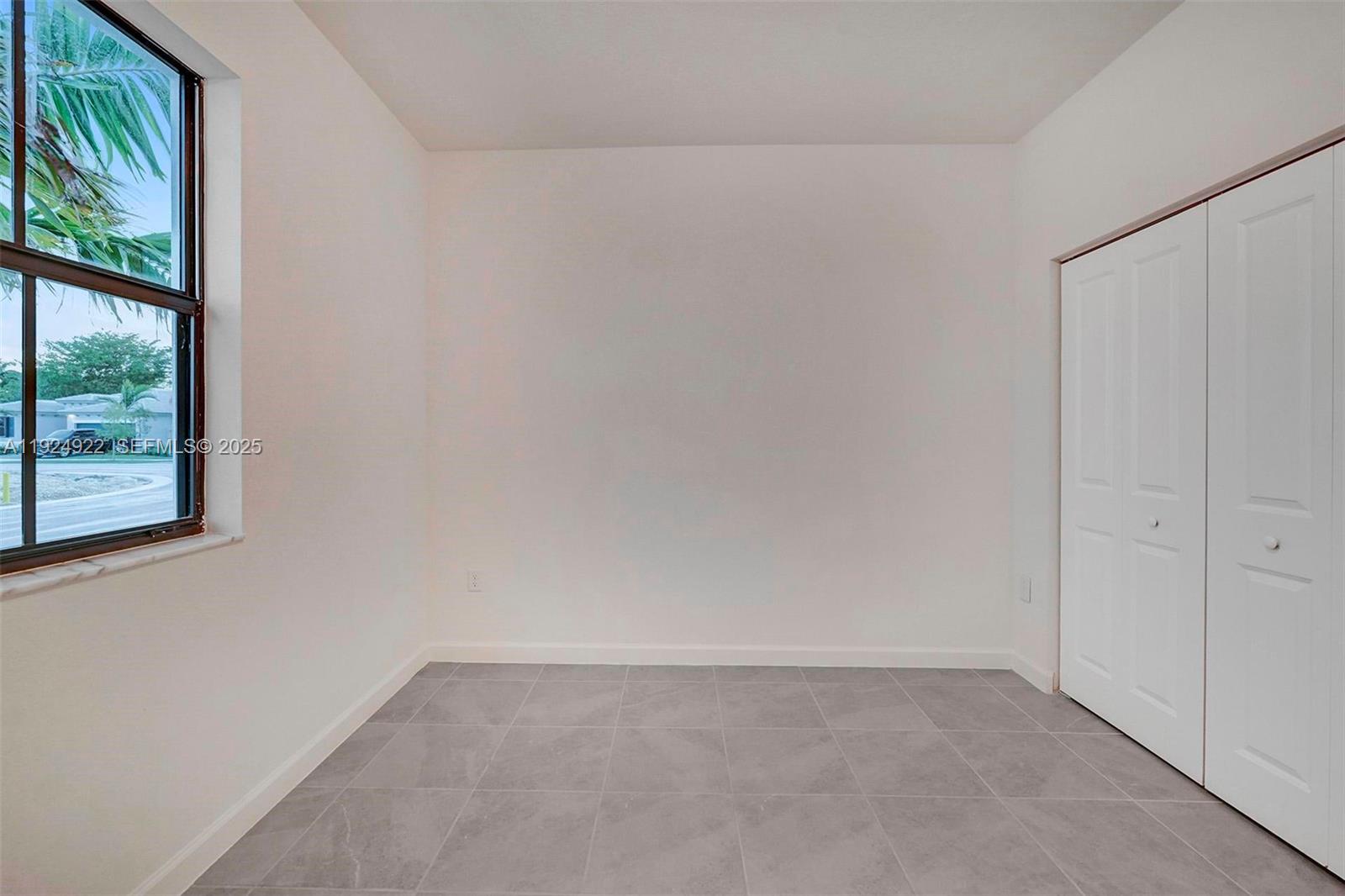 13405 Southwest 285th Street, Unit 13405 Homestead, FL 33033 - Photo 13 of 59 a view of an empty room and window