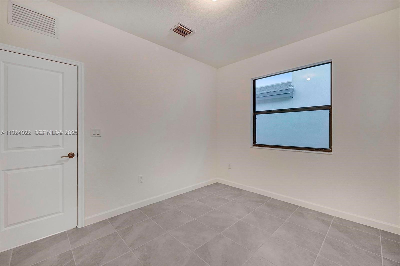 13405 Southwest 285th Street, Unit 13405 Homestead, FL 33033 - Photo 18 of 59 an empty room with closet