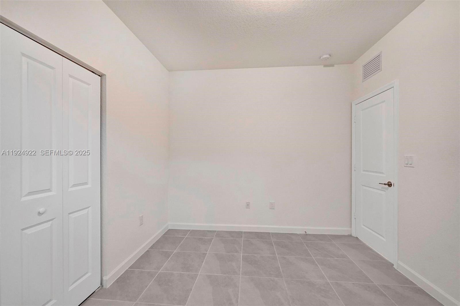 13405 Southwest 285th Street, Unit 13405 Homestead, FL 33033 - Photo 21 of 59 a view of an empty room