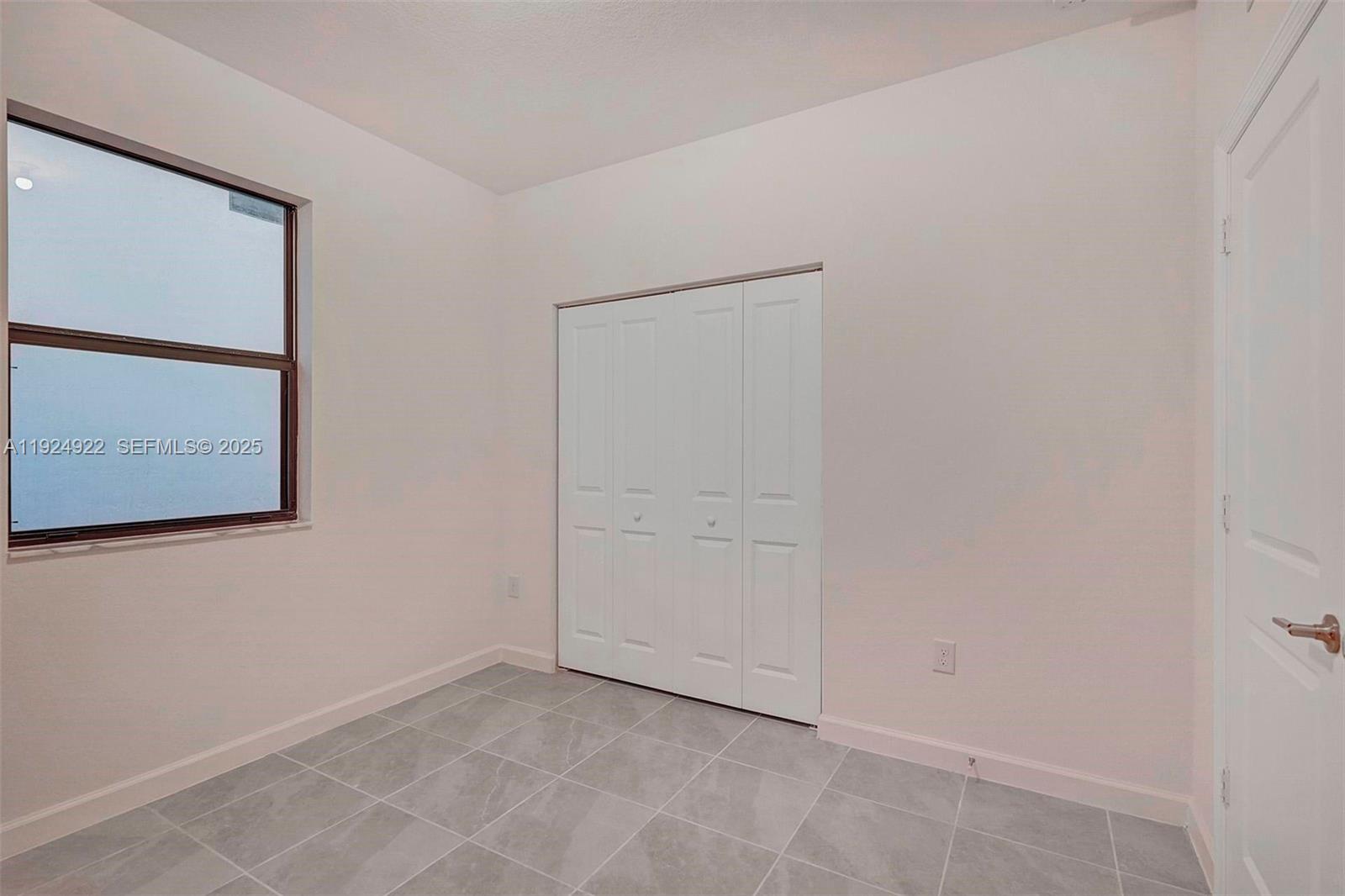 13405 Southwest 285th Street, Unit 13405 Homestead, FL 33033 - Photo 26 of 59 a view of an empty room