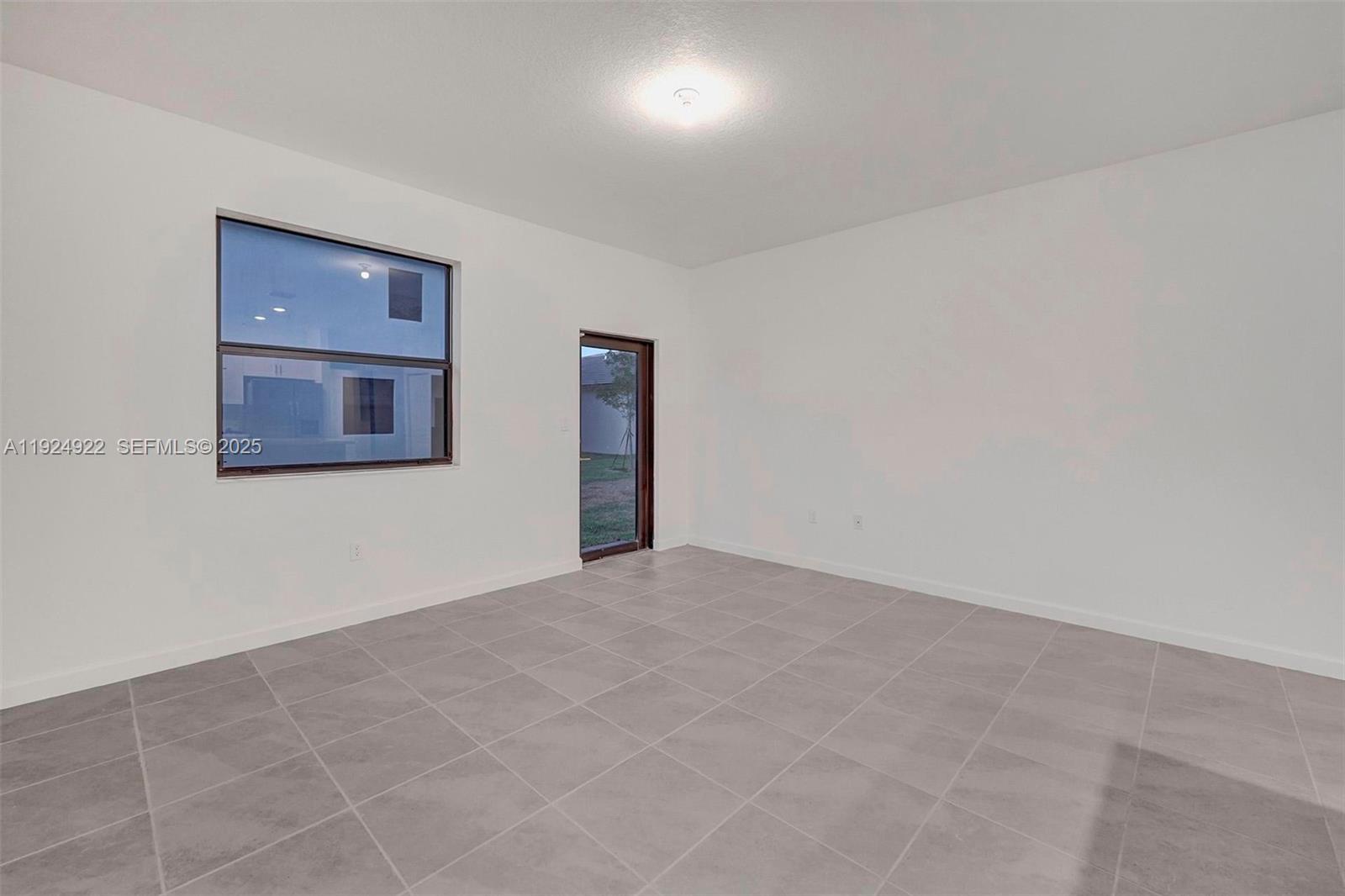 13405 Southwest 285th Street, Unit 13405 Homestead, FL 33033 - Photo 39 of 59 a view of an empty room with a window