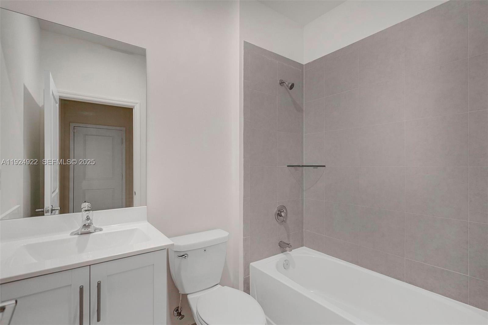 13405 Southwest 285th Street, Unit 13405 Homestead, FL 33033 - Photo 44 of 59 a bathroom with a sink toilet and vanity