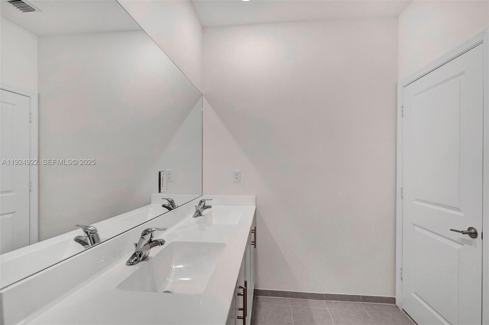 13405 Southwest 285th Street, Unit 13405 Homestead, FL 33033 - Photo 48 of 59 a bathroom with a sink and a mirror