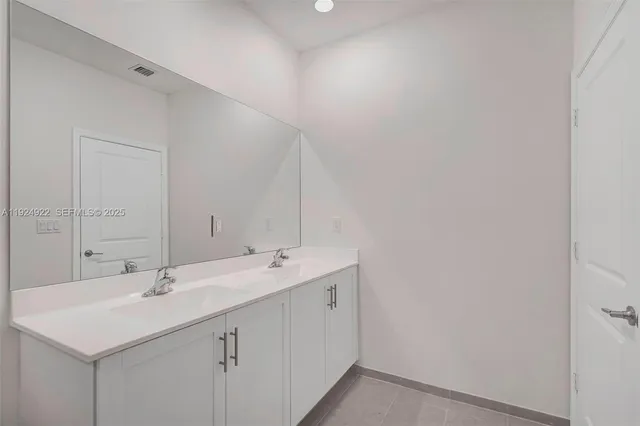 a view of a backyard with wooden fence