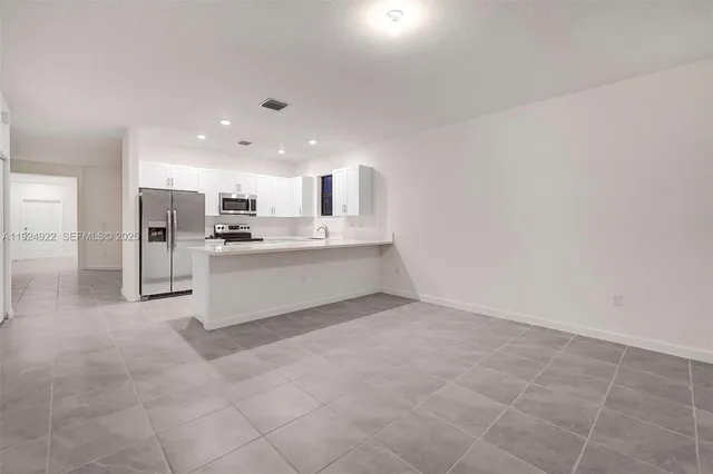 a view of a kitchen with a sink
