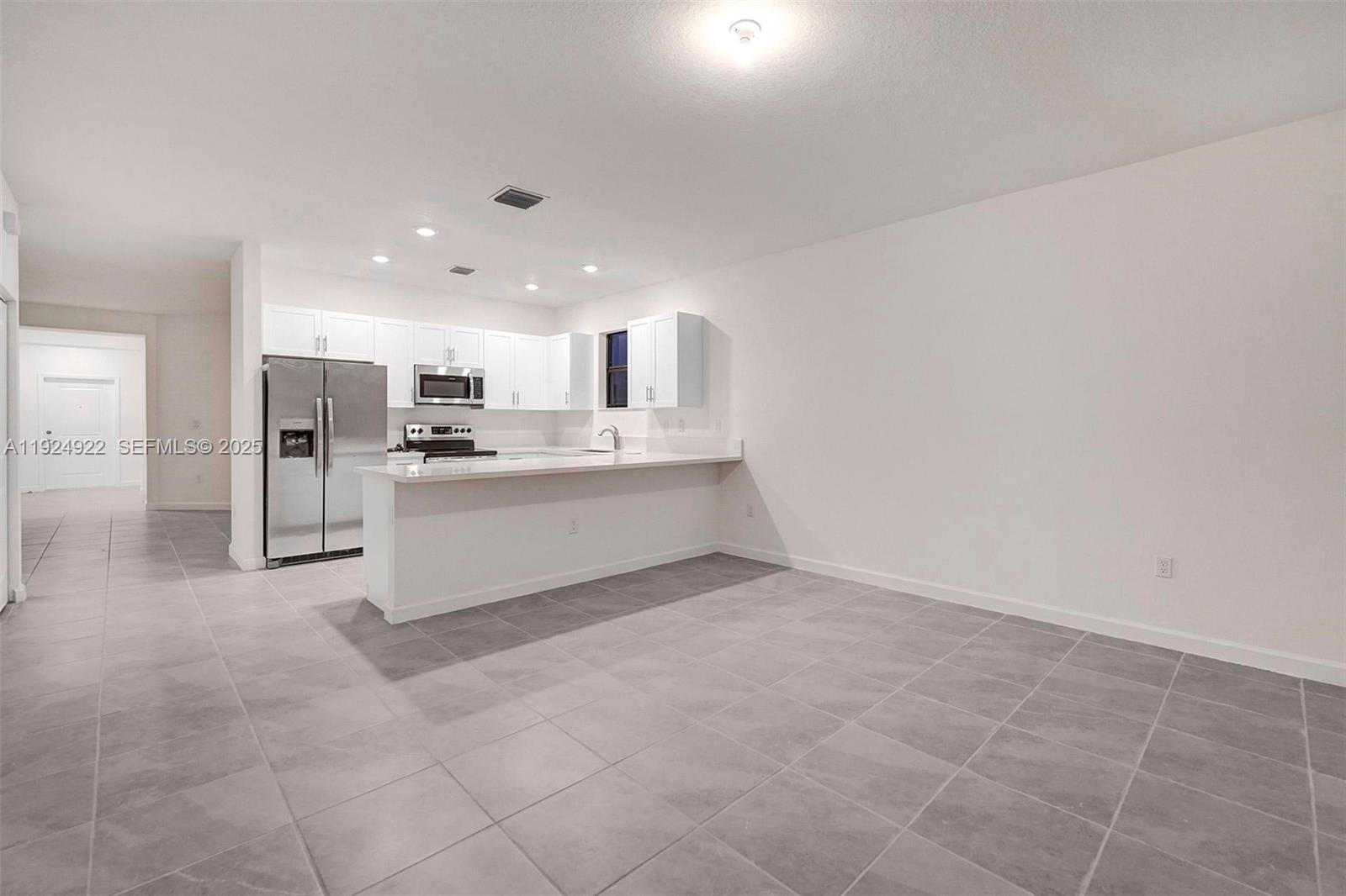 13405 Southwest 285th Street, Unit 13405 Homestead, FL 33033 - Photo 9 of 59 a view of a kitchen with a sink