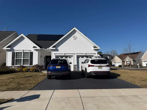 a car parked in front of a house