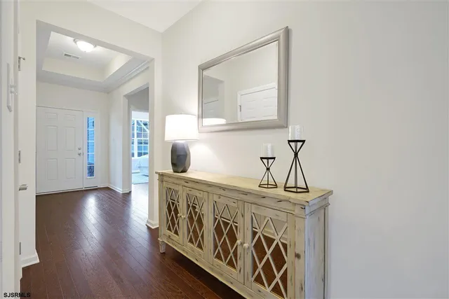 a view of an entryway with wooden floor