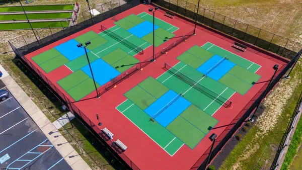 a living room with furniture wooden floor and a flat screen tv