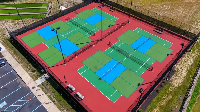 a living room with furniture wooden floor and a flat screen tv