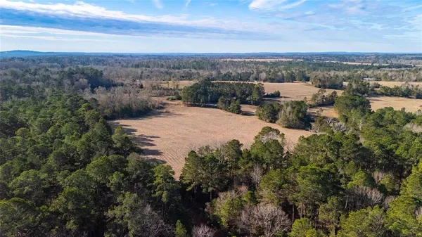 a view of a lake with mountains and mountain view in back