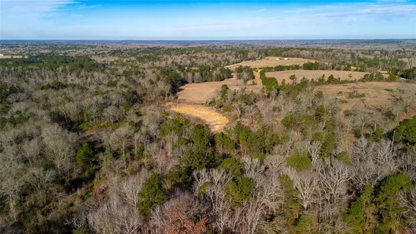 an aerial view of residential building and lake