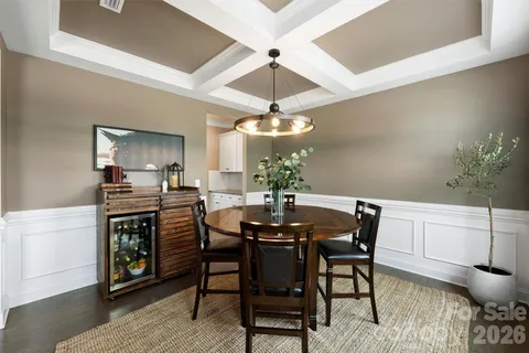 a kitchen with stainless steel appliances kitchen island granite countertop a stove a sink and a microwave