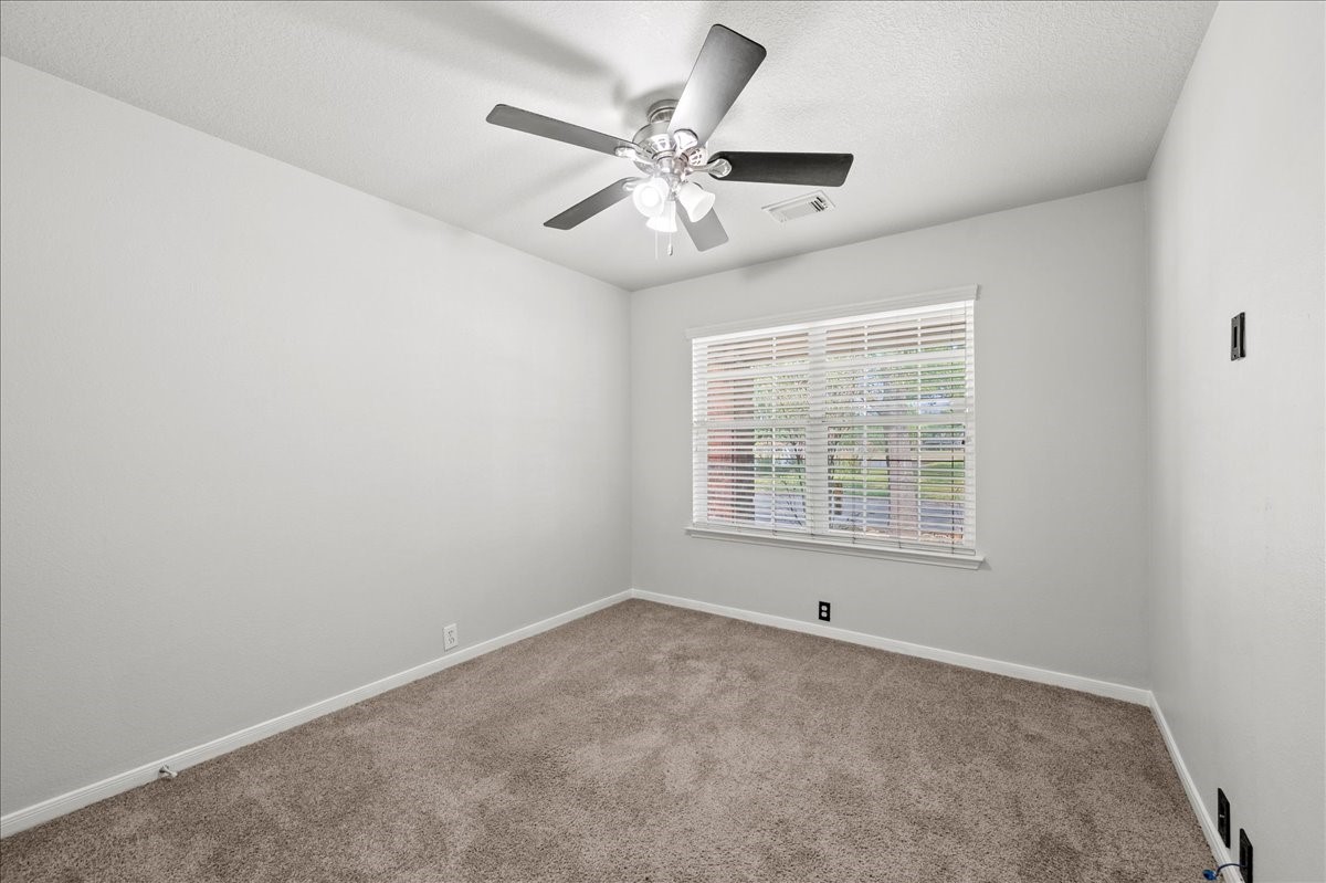17535 Prospect Meadows Drive Houston, TX 77095 - Photo 23 of 39 Nestled away from the primary bedroom, the secondary bedrooms offer a serene retreat, perfect for family members or guests seeking privacy. Each room is designed with comfort in mind, featuring soft color palettes and ample natural light that creates a welcoming atmosphere.