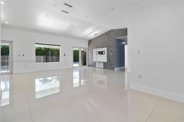 a view of a hallway with windows