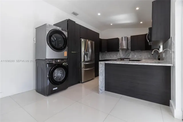 a kitchen with a stove and a refrigerator