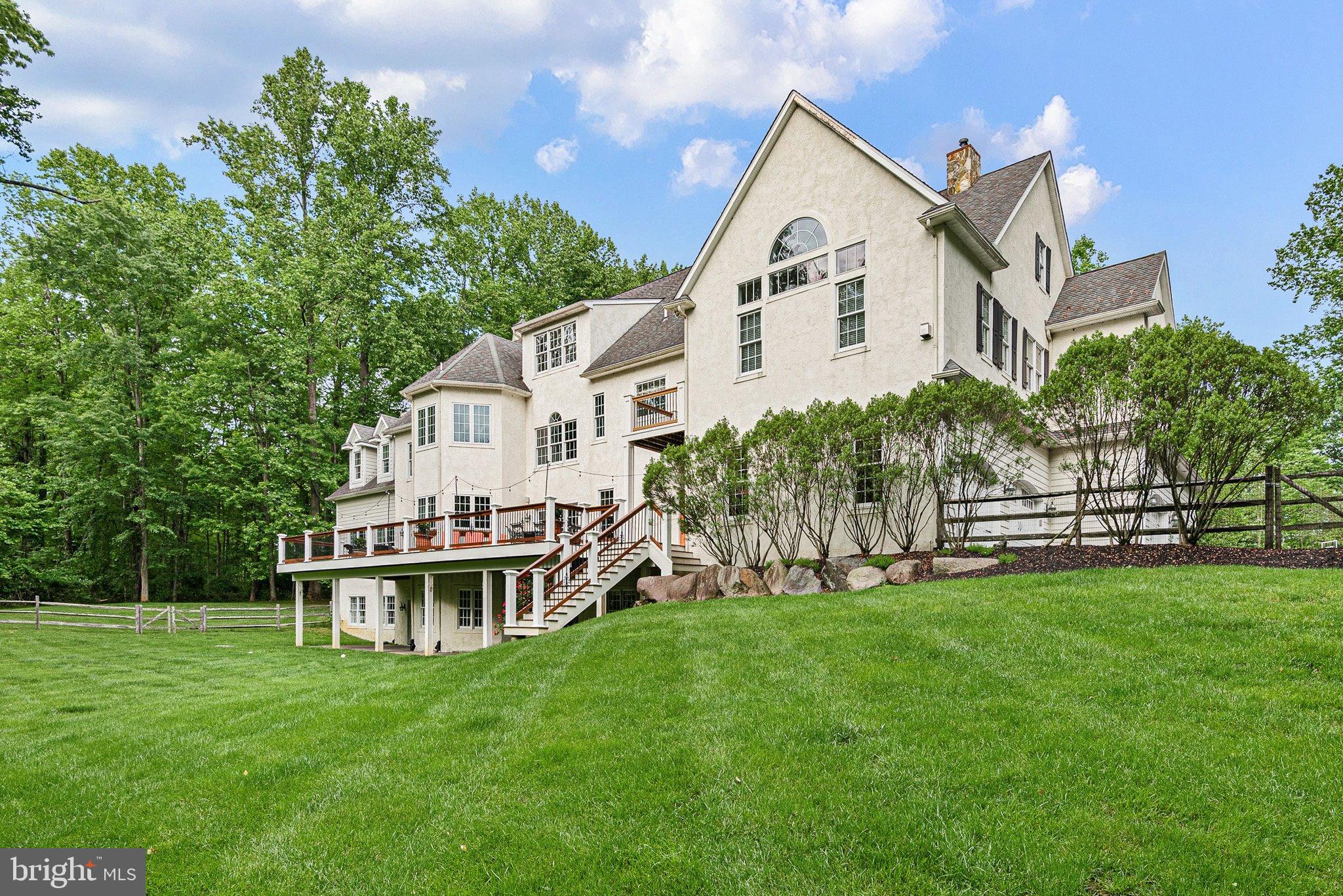 104 Timber Ridge Lane Chadds Ford, PA 19317 - Photo 63 of 65 a view of a house with a yard and sitting area