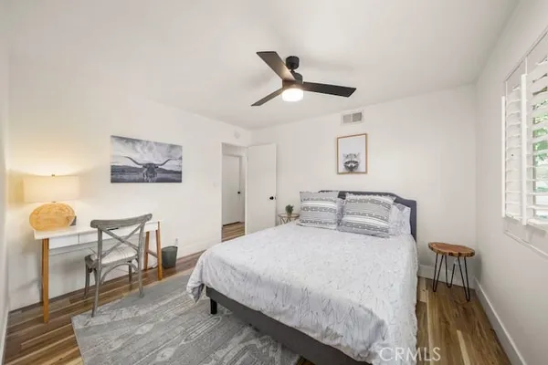 a bedroom with a bed and a table in it
