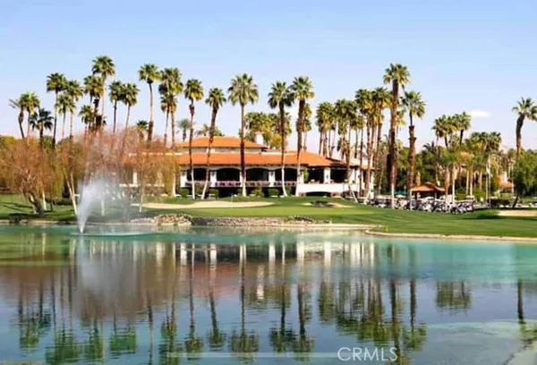 a view of swimming pool and trees