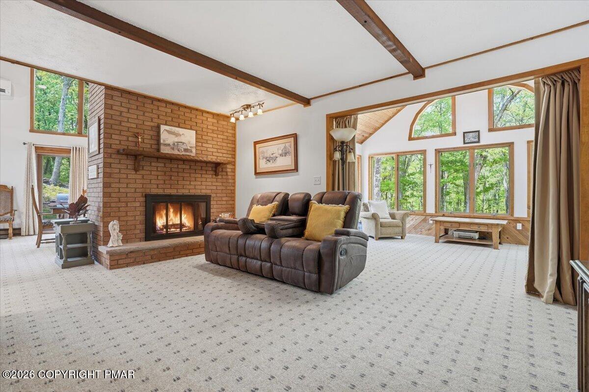 1517 Deer Run East Bushkill, PA 18324 - Photo 7 of 42 a living room with furniture and a fireplace