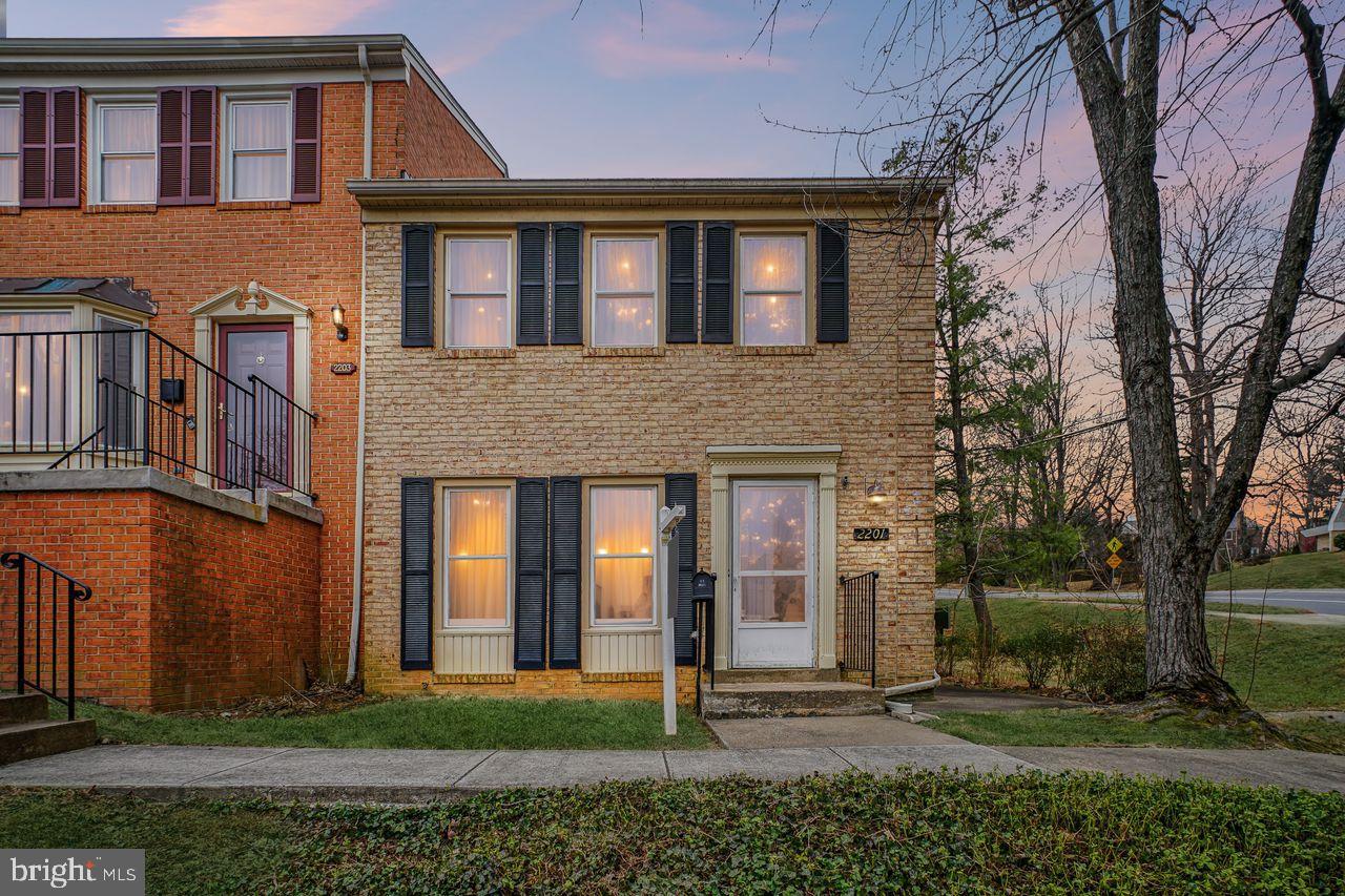 Charming brick home with inviting glow.