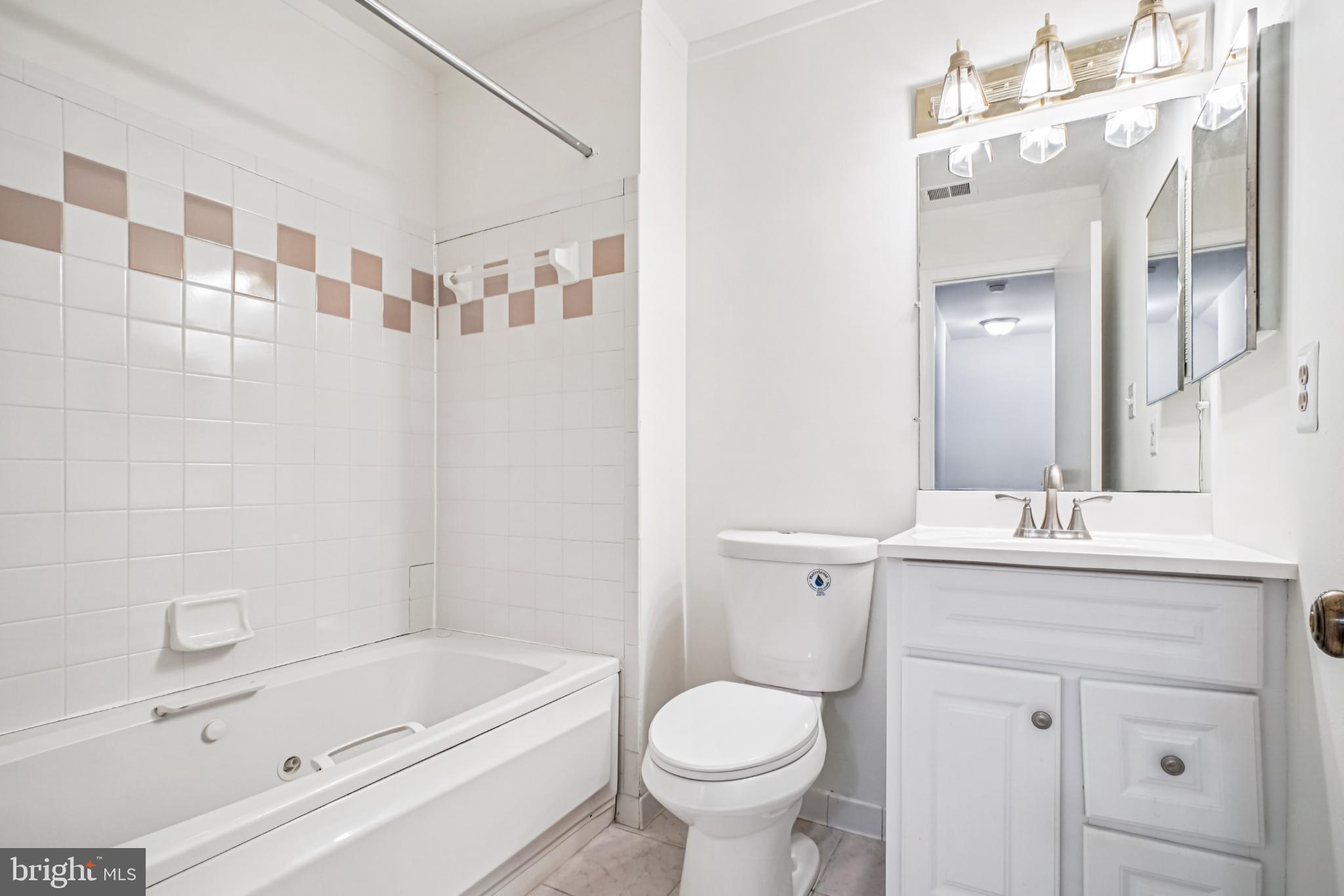 2201 McLean Park Road Falls Church, VA 22043 - Photo 29 of 40 Main hall bathroom with modern touches.